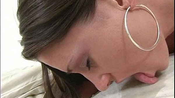 Petite brunette stretching her pussy with a thick dildo